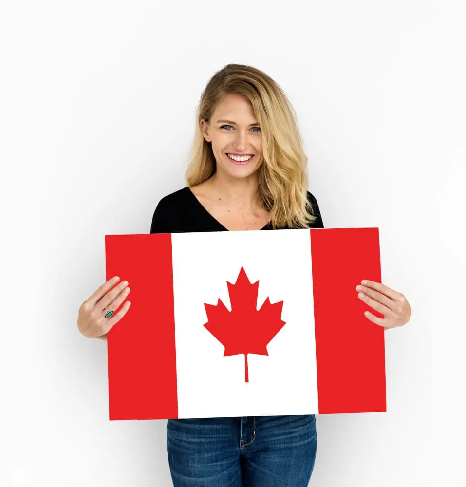 happy woman hands hold canada flag